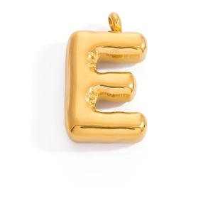 Macro shot of a 3D balloon style golden letter E pendant with shiny metallic texture