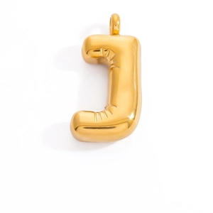 Macro detail of puffy letter J gold pendant with realistic inflatable texture and mirror finish