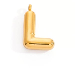 Macro view of 3D puffed gold letter L pendant with high polish and round hanging loop