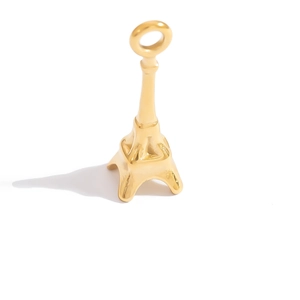 Detailed view of polished 18K gold Eiffel Tower pendant with top ring for DIY jewelry