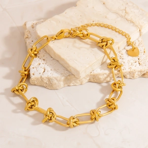 Bracelet à gros maillons en acier inoxydable plaqué or 18K avec nœuds et pendentif cœur