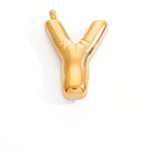Detailed macro view of a 3D balloon-style letter Y pendant in polished gold