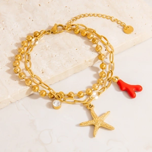 Bracciale a doppio strato in acciaio dorato con ciondoli a stella marina e corallo