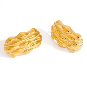 Chunky gold sea snail shell earrings with 18K gold plating and wavy ripple texture