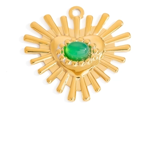 Detail view of heart-shaped 18K gold pendant with green gemstone and radiant sunburst design