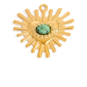 Detailed view of heart shaped gold pendant with sunburst rays and green stone inlay