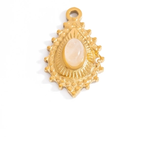 Macro detail of 18K gold heart oval pendant with pink gemstone and radial texture