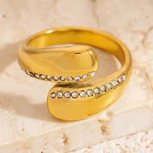 Polished 18K gold plated titanium steel bypass ring with shimmering zircon inlay
