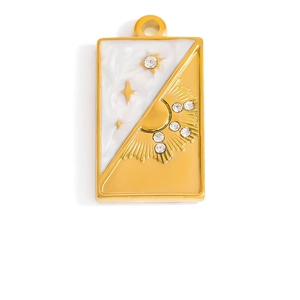 Detail of a rectangular gold tarot pendant featuring a star and sun design with mother-of-pearl