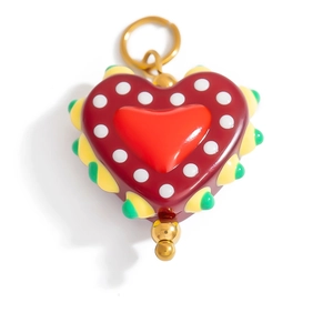 Detailed close-up of a colorful heart-shaped resin pendant with vibrant dots and gold beads