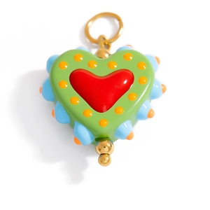 Detailed macro view of colorful handmade heart pendant with vibrant enamel finish