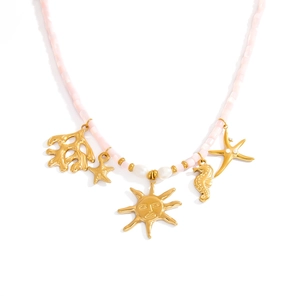 Pink stone beaded necklace with sun and starfish gold charms and white pearl accents