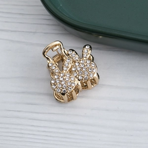 Pince à cheveux lapin dorée élégante avec strass et perles au design minimaliste