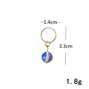 Detail shot of golden spiral ring with blue marble bead, dimensions 3.3cm by 1.4cm