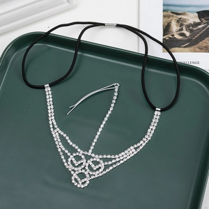 Detailed macro view of silver Gothic multilayer forehead chain with sparkling rhinestones