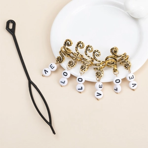 Golden spiral dreadlock hair rings with LOVE beads and a black pulling tool kit