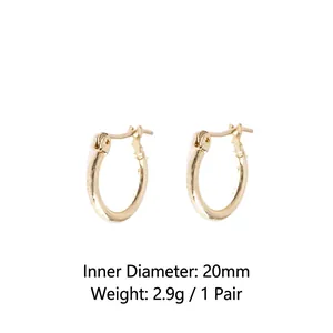 Detail view of 20mm gold hoop earrings with 2.9g weight and secure clasp design