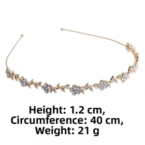 Macro view of gold floral headband with rhinestones showing 40cm length and 1.2cm height