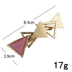 Golden geometric overlapping triangle hair clip with pink resin and hollow frames for women