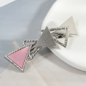 Geometric overlapping triangle hair clip with silver alloy and pink glitter finish