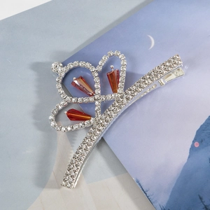 Barrette à cheveux couronne étincelante avec strass argentés et cristaux rouge-orange
