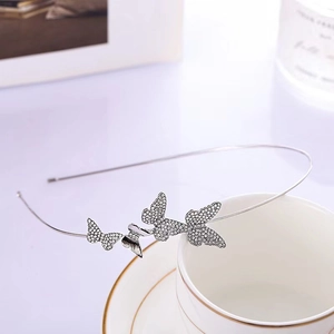 Serre-tête papillon argenté élégant avec strass pour mariée ou coiffures de soirée chic