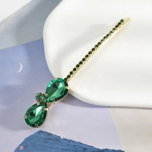 Pince à cheveux dorée élégante avec strass vert goutte d'eau et cristaux brillants