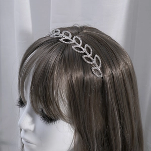 Elegant silver leaf headband with sparkling rhinestones for wedding and evening hairstyles