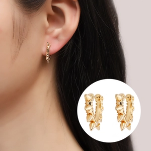 Punk style gold-plated copper hoop earrings with spike rivets and micro-set zircon