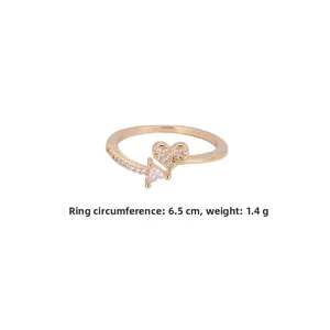 Detail view of gold-plated heart ring with zircons, weight 1.4g and 6.5cm circumference