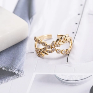 Elegant gold vintage leaf ring with cubic zirconia stones shown from a 45-degree angle