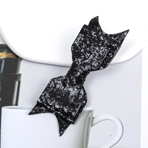 Sparkling black glitter PU leather bow hair clip for women with shimmering finish