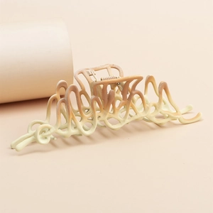 Elegant large gradient hair claw clip with a wavy hollow design for thick hair styling