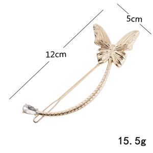 Elegant gold butterfly hair clip with crystal pendant and curved metal design, 12cm length