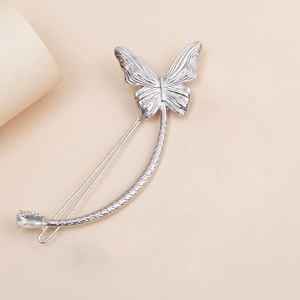 Elegant silver butterfly hair clip with moon-shaped handle and teardrop crystal stone