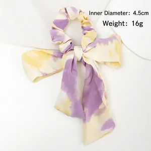 Chouchou élégant à nœud papillon tie-dye violet et jaune en mousseline plissée