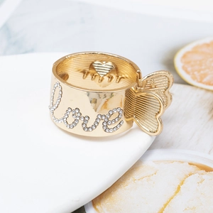 Golden metal hair claw with white rhinestones spelling Love for high ponytail hairstyle
