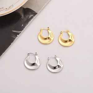 Minimalist U-shaped irregular textured earrings in polished gold and silver metal finishes