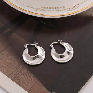 Irregular silver U-shape hoop earrings with a polished crescent metallic design for women