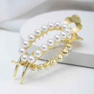 Elegant golden metal hair claw clip with white pearls for high ponytail styling
