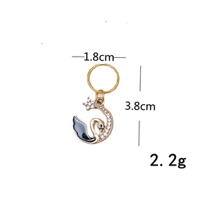 Golden swan hair braid charm with sparkling crystals and black enamel finish for styling