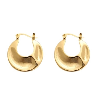 Minimalist chunky U-shaped gold earrings with polished finish and irregular texture