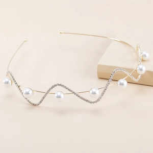Elegant wavy gold headband with white pearls and sparkling rhinestones for women