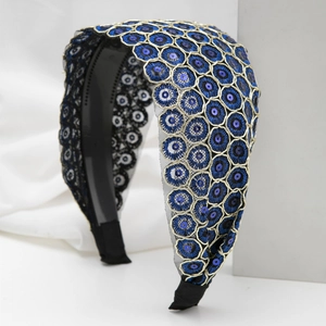 Elegant wide headband with gold embroidery and blue sequins on navy mesh fabric