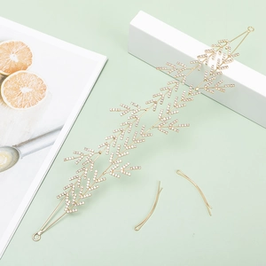 Bijou de tête mariée doré avec strass blancs et design de branches feuillues