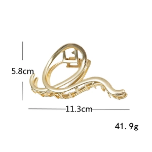 Minimalist irregular golden metal hair claw clip with stylish fluid lines and 11.3cm length