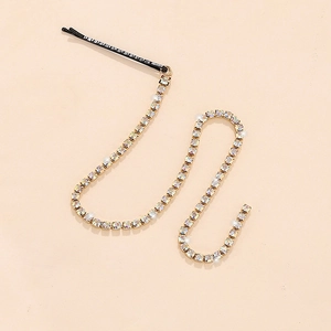 Minimalist black hairpin with elegant long colorful rhinestone fringe chain on light background