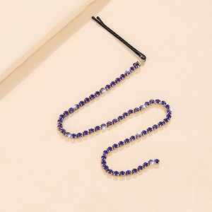 Elegant black hair clip featuring long sapphire blue rhinestone fringe tassels and gold setting