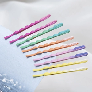 Set of 10 colorful candy-colored wave bobby pins on a light blue card with a matte finish