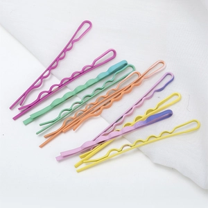 Set of colorful wave-shaped metal hairpins in macaron candy colors for daily styling